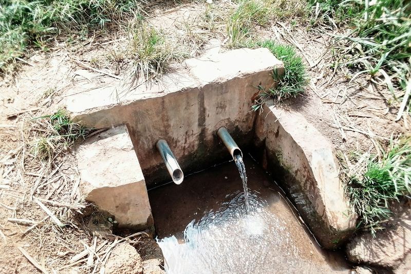 Drainage pipe outlet discharging water into a ditch